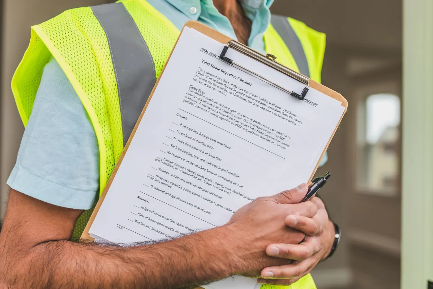 An inspector holding a clipboard with an inspection checklist